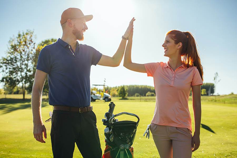 couple playing golf